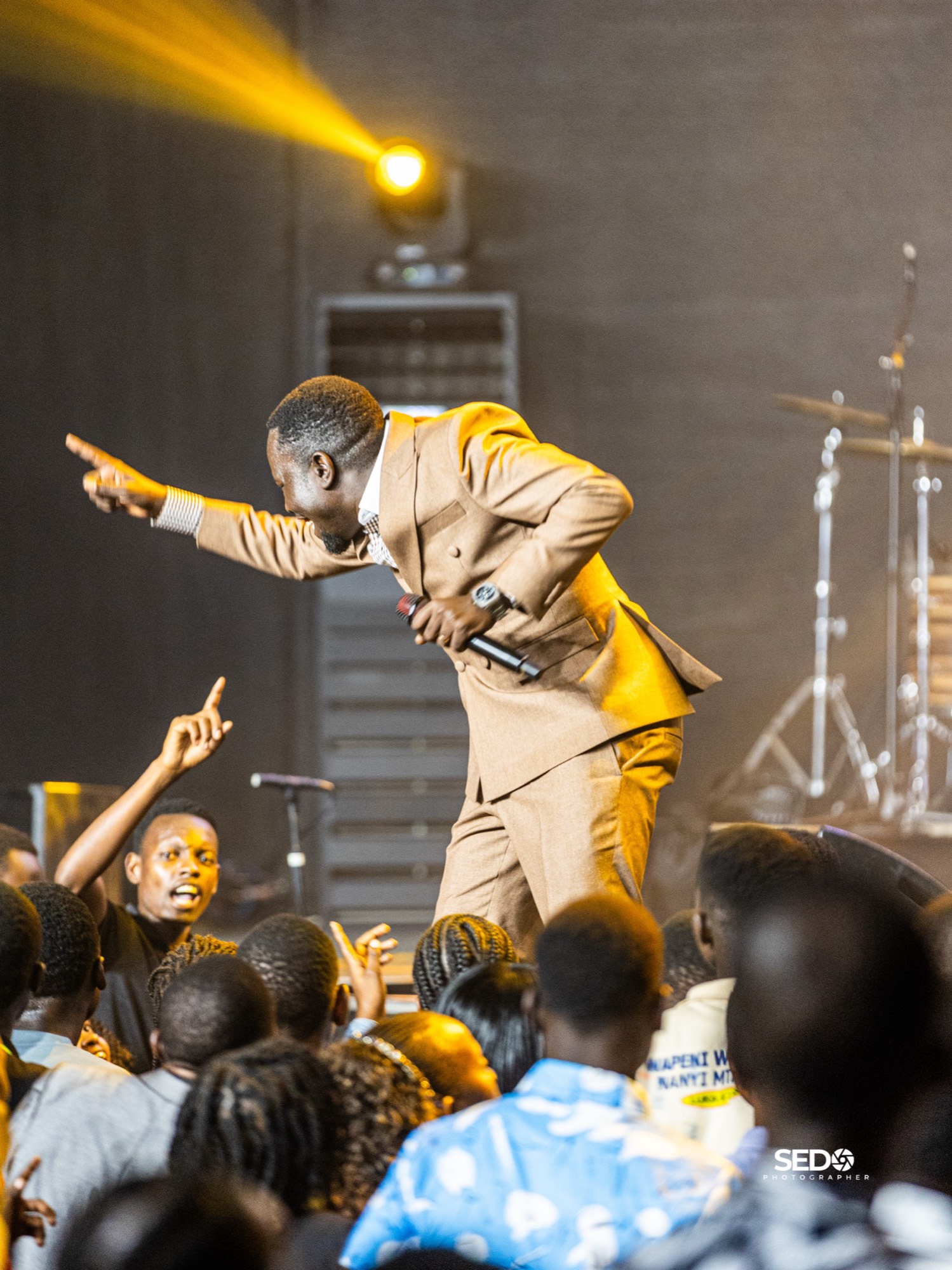 Pastor Epa ministering to the congregation at Power Encounter