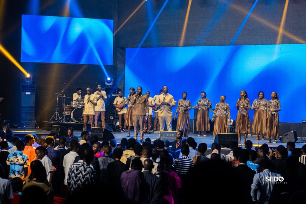Pastor Epa and the worship team leading the crowd at Power Encounter