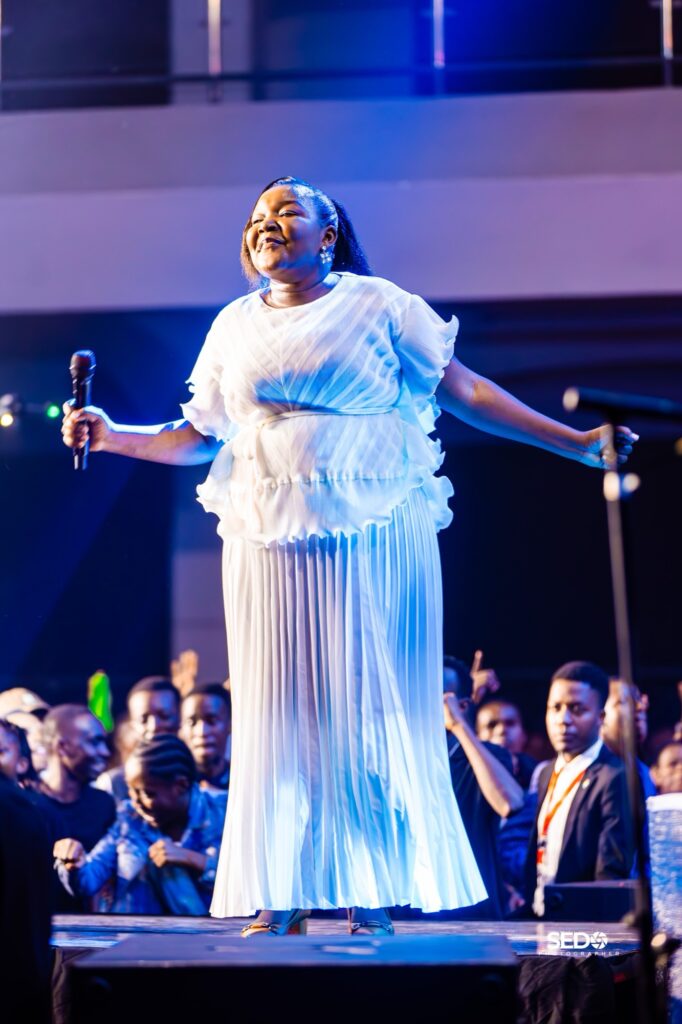 Worship leader rejoicing on stage at Power Encounter